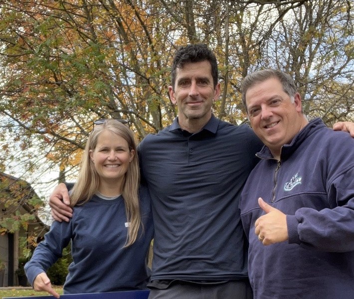 Greg Cox with his wife Kim and Cam Guthrie